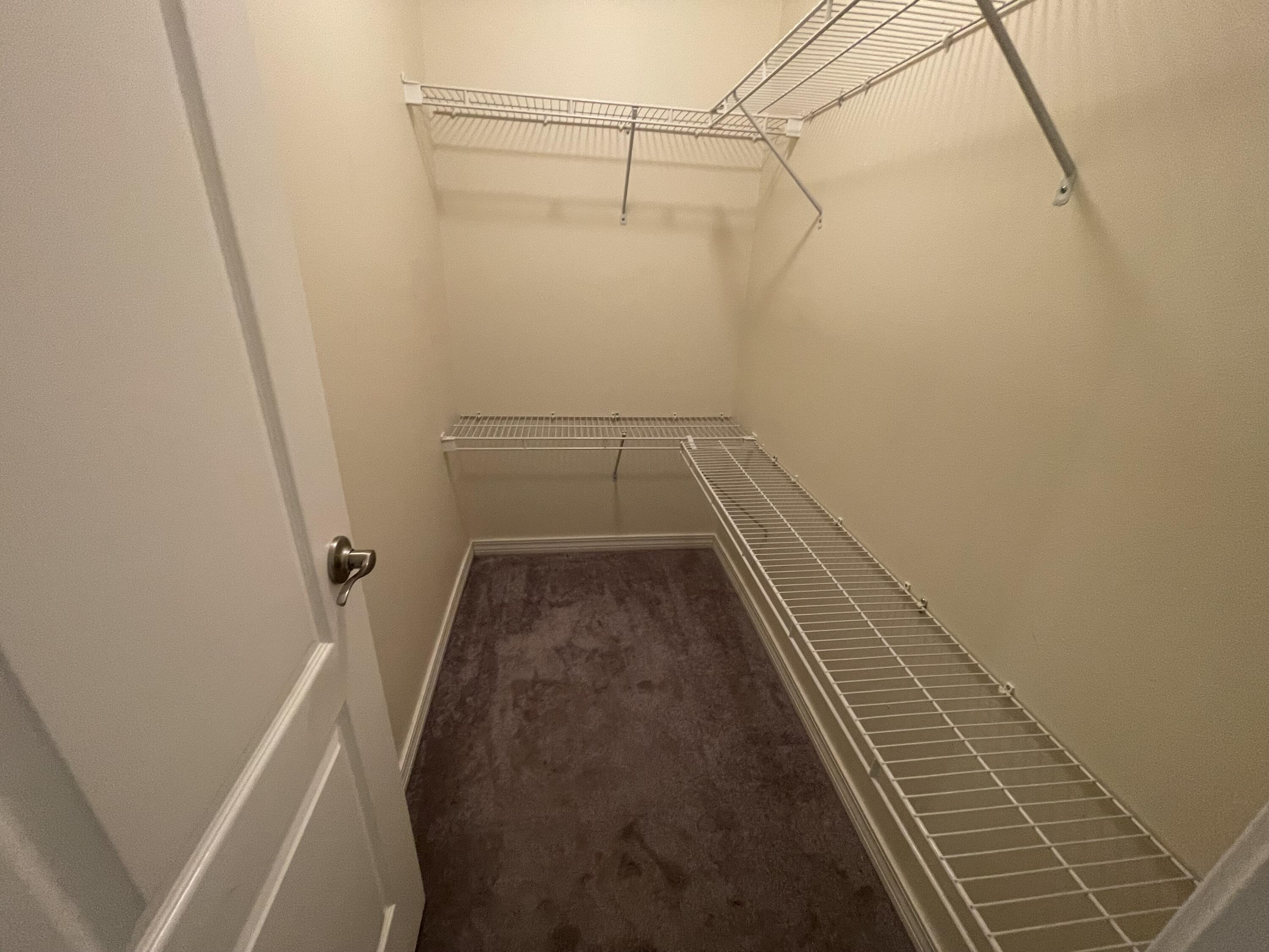 728 Riva Ridge Drive Crestview, FL 32539 - Photo 23 of 26 a view of a room with racks on the wall