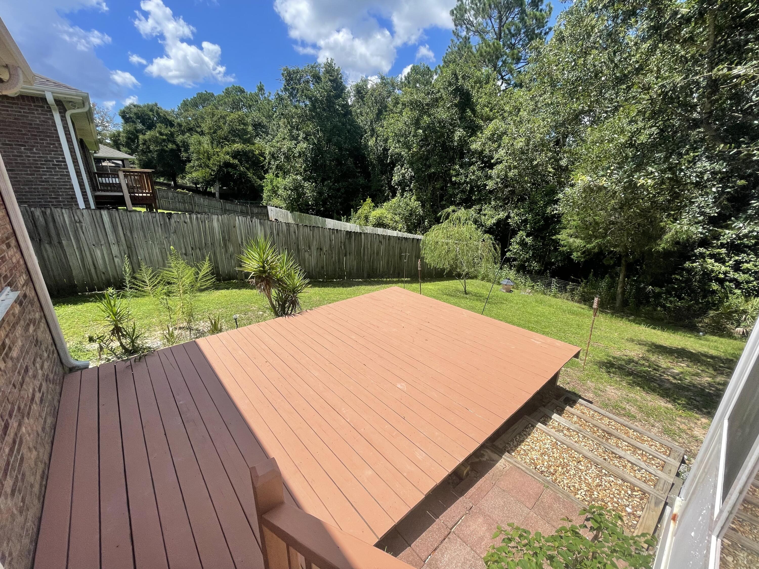 728 Riva Ridge Drive Crestview, FL 32539 - Photo 25 of 26 a view of a backyard with sitting area
