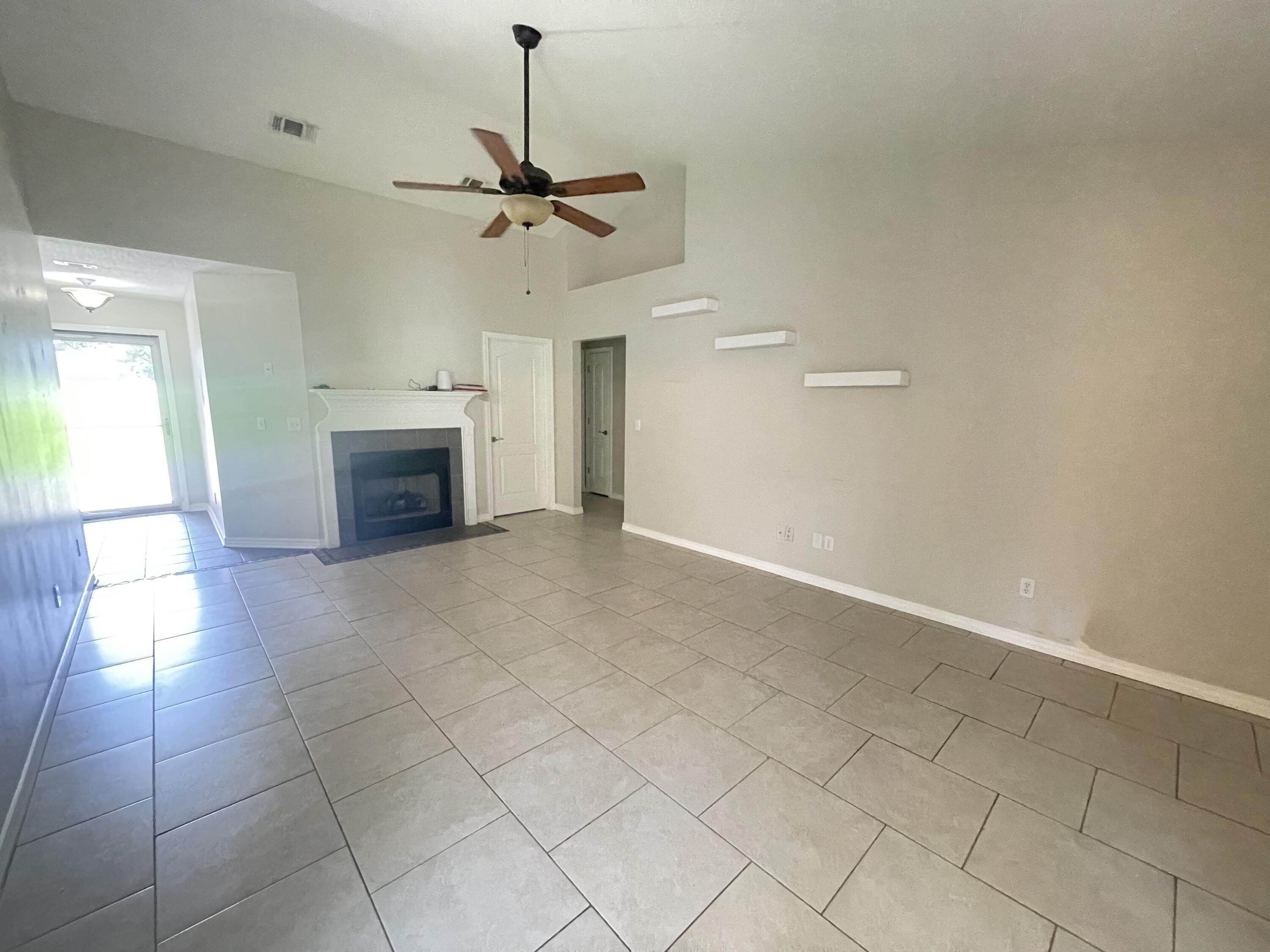 728 Riva Ridge Drive Crestview, FL 32539 - Photo 3 of 26 a view of an empty room with a fireplace