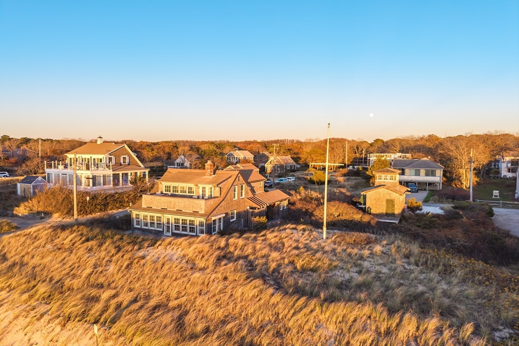 1145 Kingsbury Beach Road Eastham, MA 02642 - Photo 41 of 42 an aerial view of residential houses with outdoor space