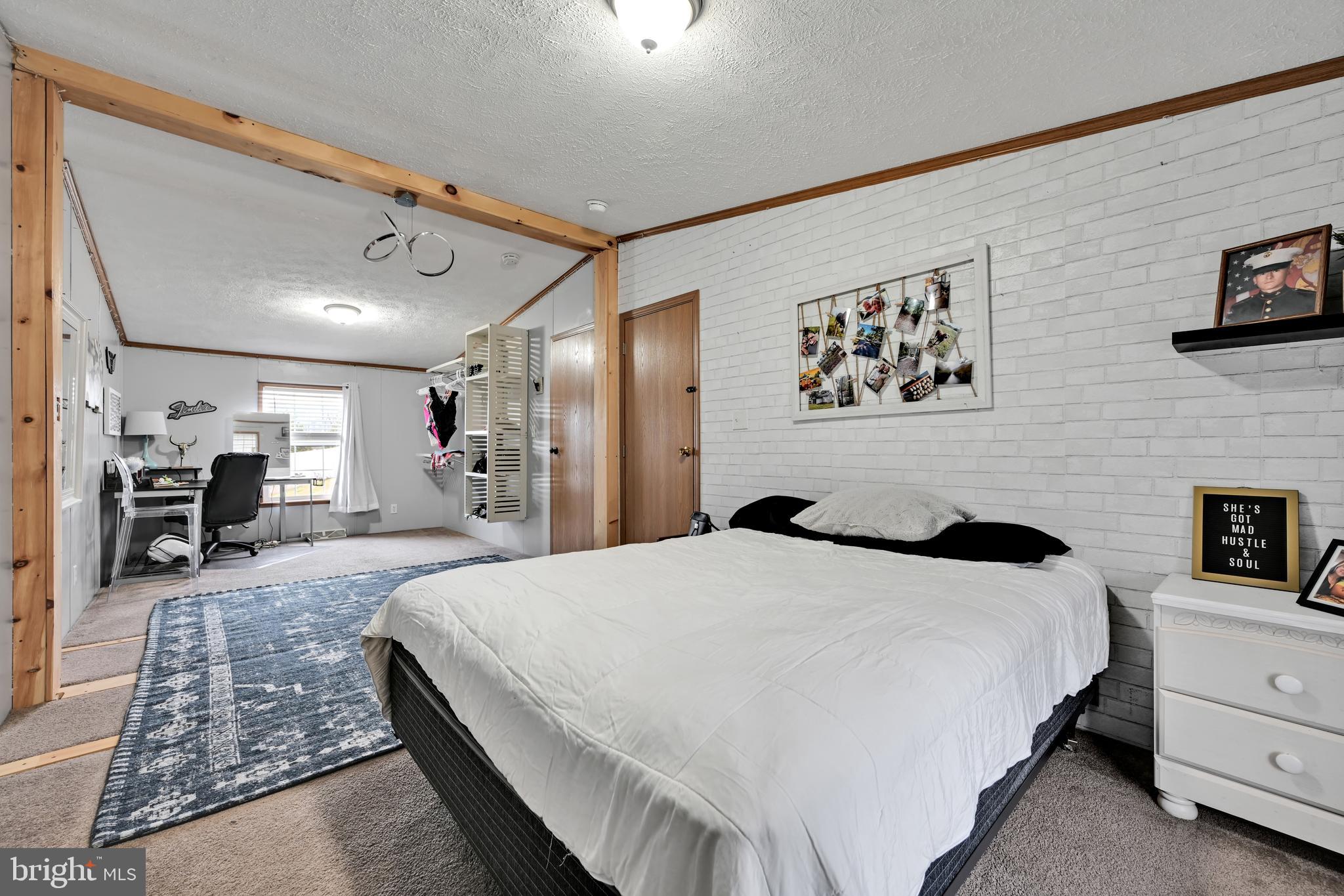 60 Bordnersville Road Jonestown, PA 17038 - Photo 26 of 45 a large bedroom with a bed and a flat screen tv