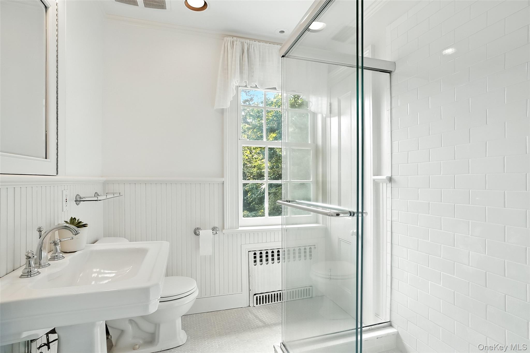 14 Mendota Avenue Rye, NY 10580 - Photo 16 of 33 a bathroom with a sink a toilet and shower