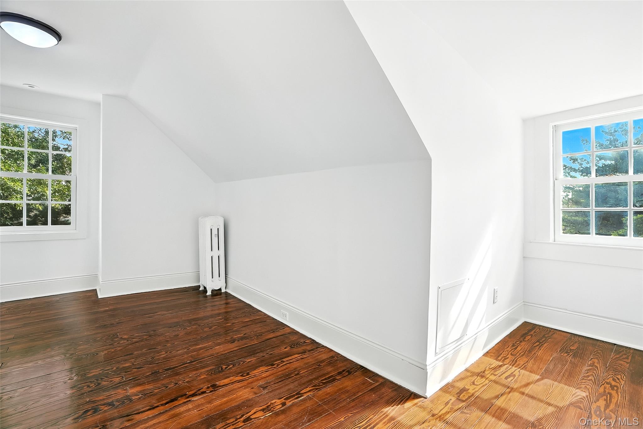 14 Mendota Avenue Rye, NY 10580 - Photo 22 of 33 an empty room with wooden floor and windows