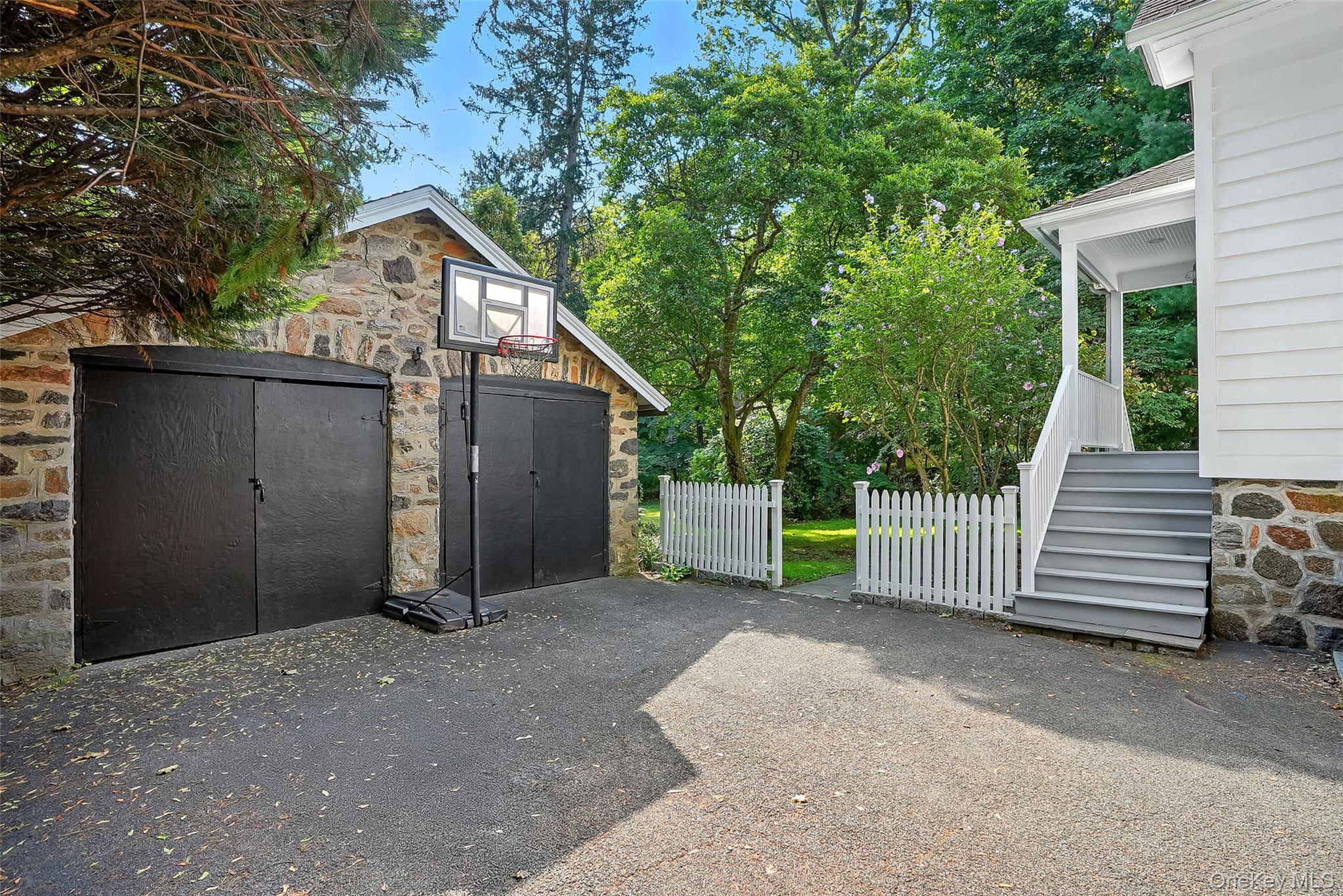 14 Mendota Avenue Rye, NY 10580 - Photo 24 of 33 a view of a house with a yard and garage