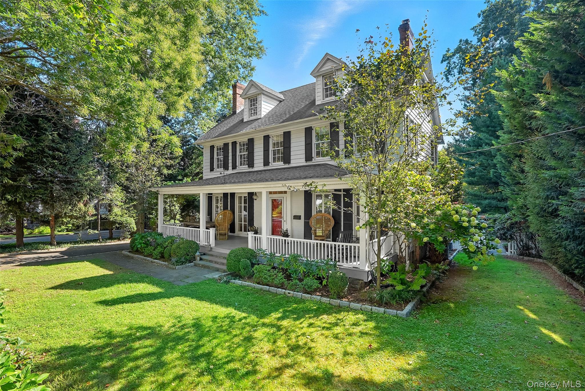 14 Mendota Avenue Rye, NY 10580 - Photo 25 of 33 a front view of a house with a yard