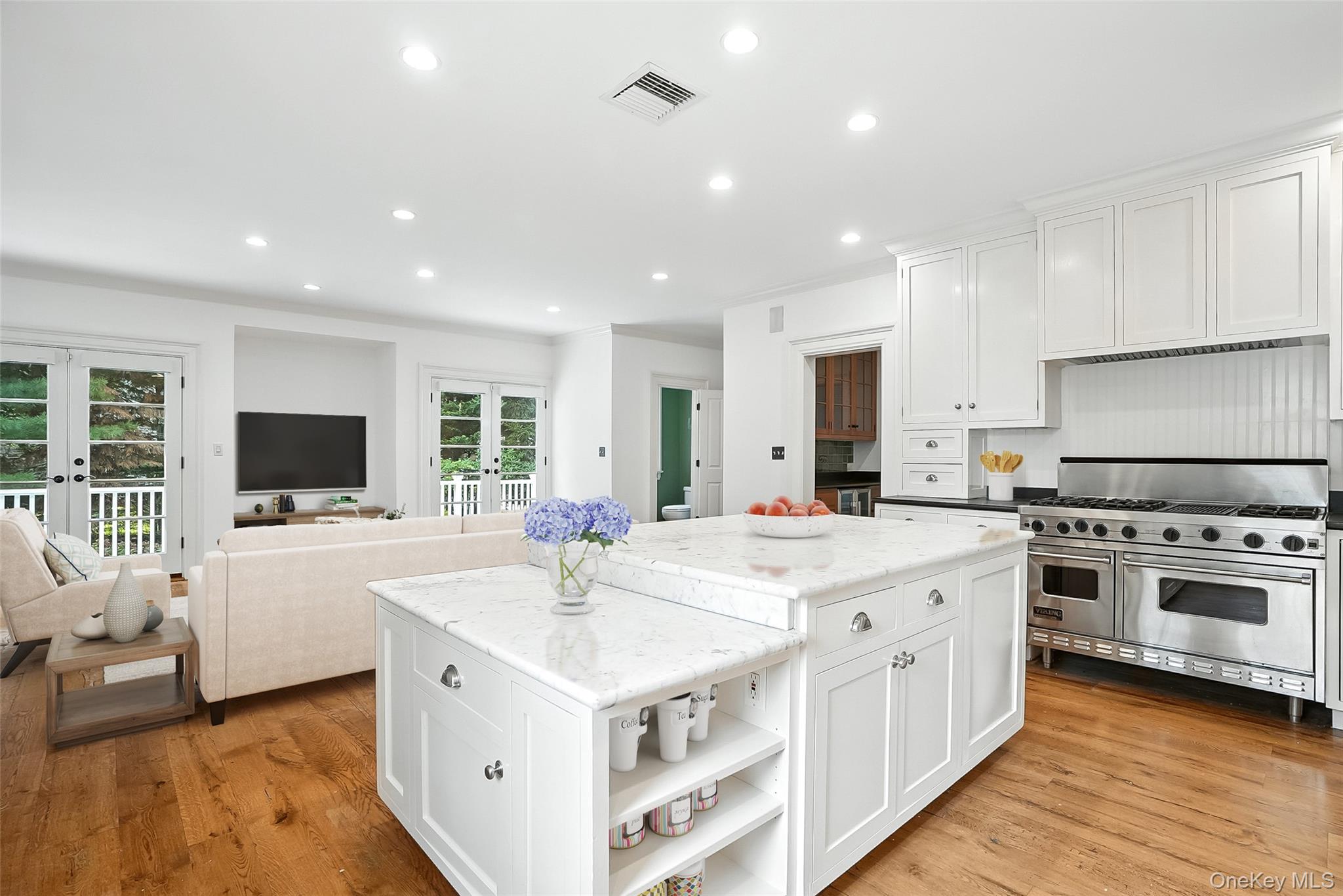 14 Mendota Avenue Rye, NY 10580 - Photo 10 of 33 a large white kitchen with a stove top oven a sink a counter space and cabinets