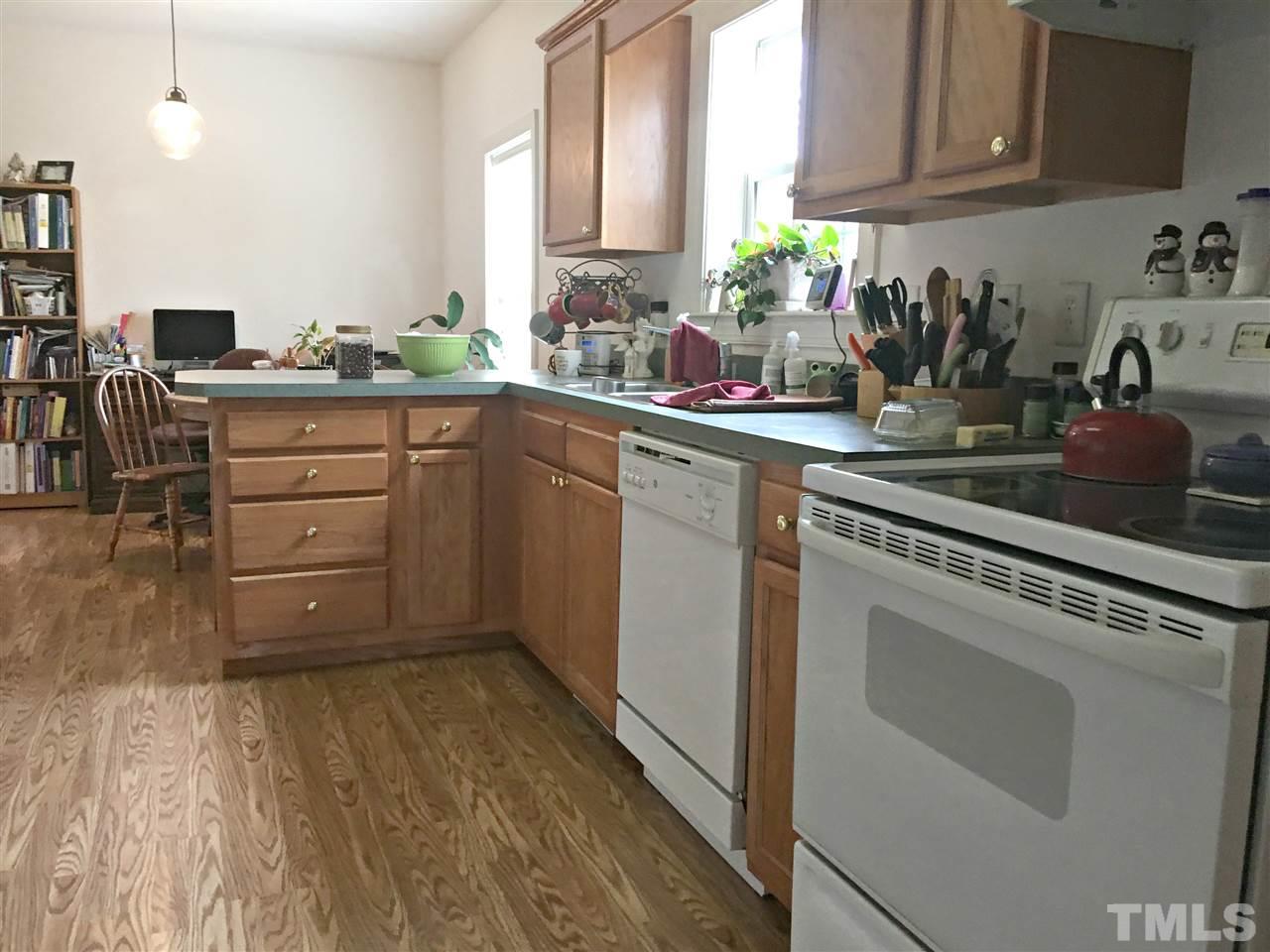 375 Ole Cabin Road Roxboro, NC 27574 - Photo 3 of 11 a kitchen with appliances cabinets and a sink