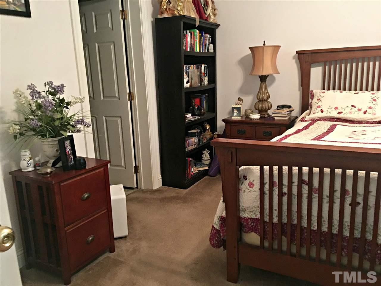 375 Ole Cabin Road Roxboro, NC 27574 - Photo 7 of 11 a bedroom with a bed and furniture