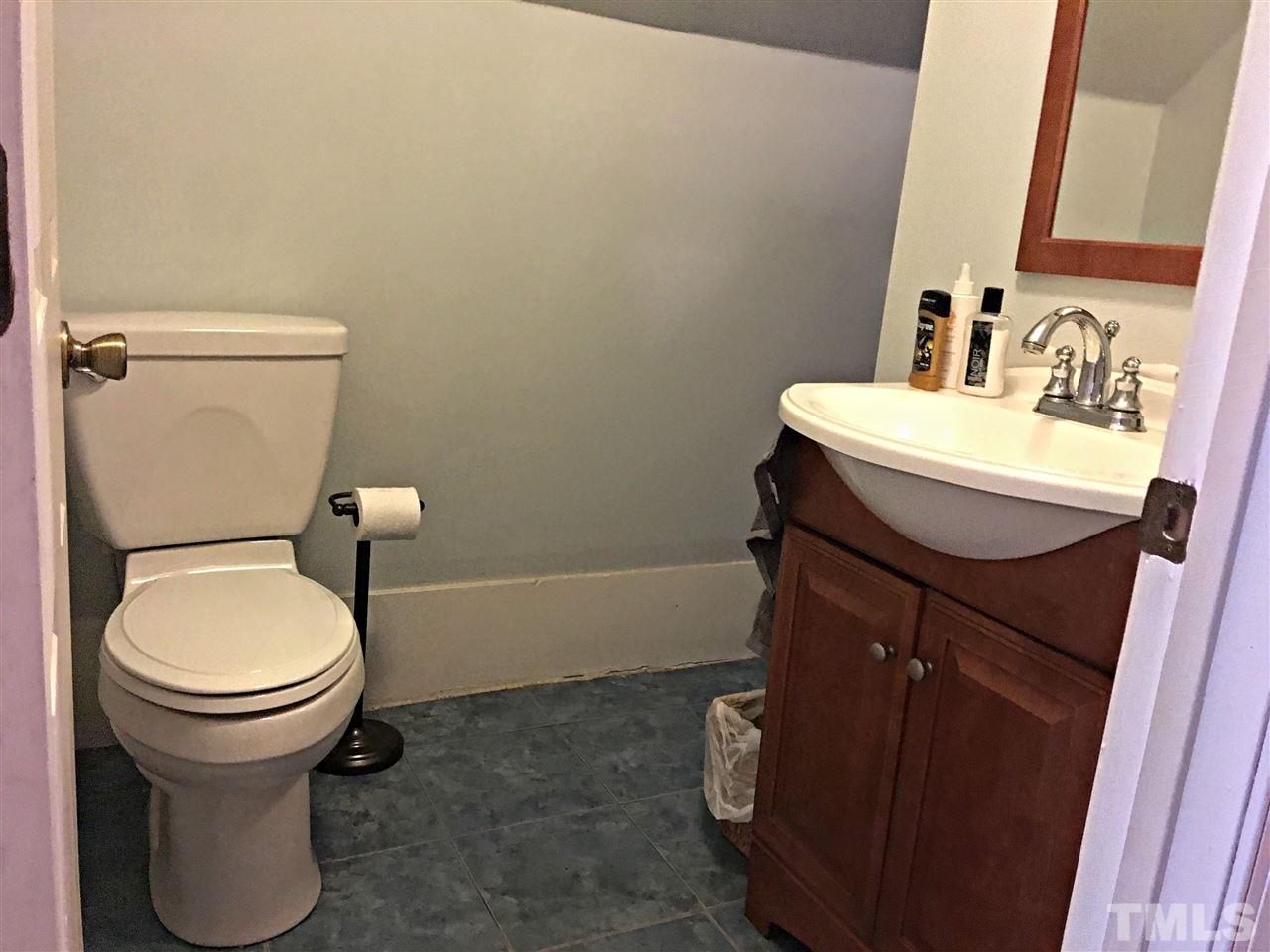 375 Ole Cabin Road Roxboro, NC 27574 - Photo 9 of 11 a bathroom with a sink and a toilet
