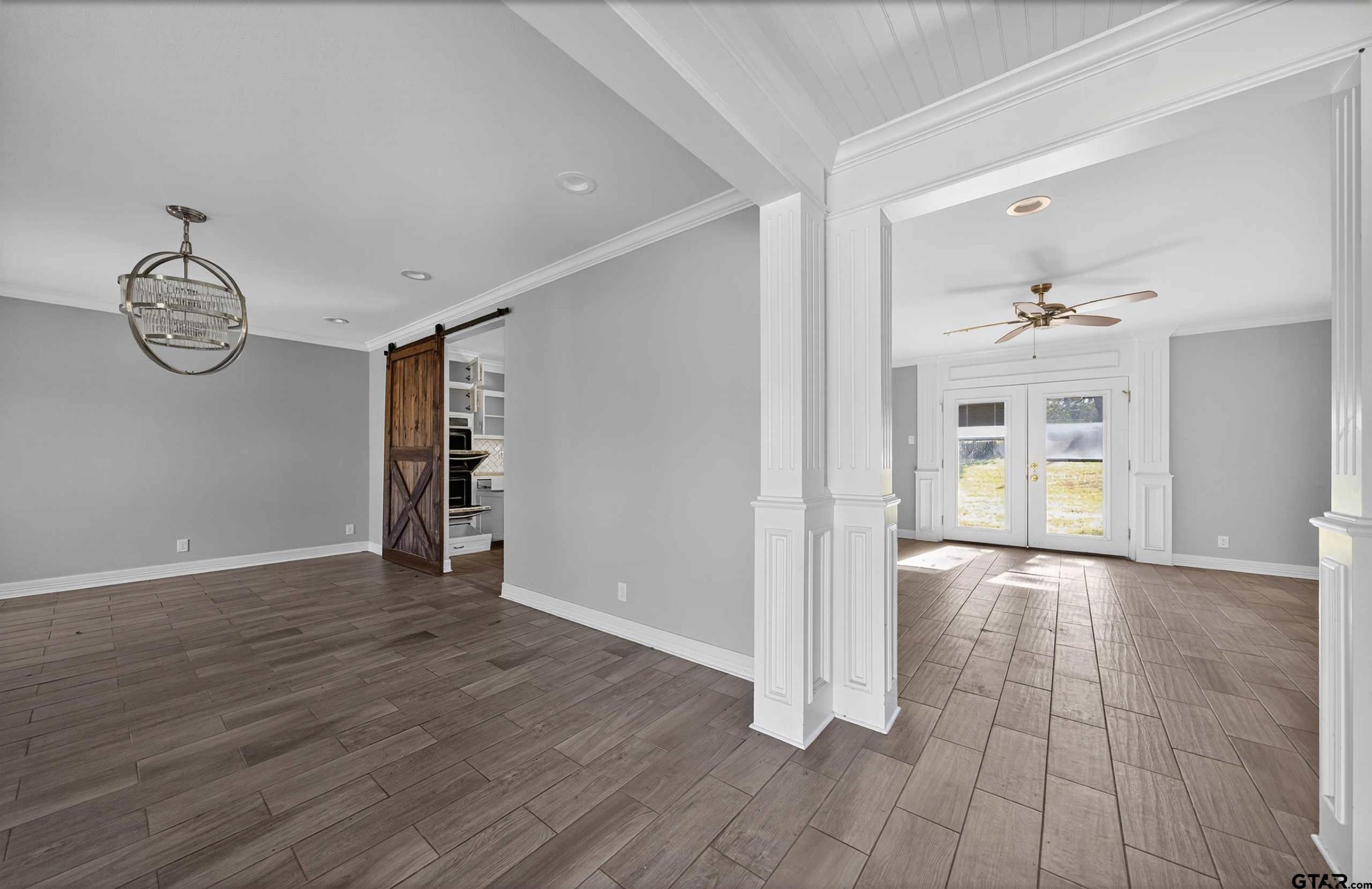 3408 Jackson Avenue Tyler, TX 75705 - Photo 14 of 45 wooden floor in an empty room with a window