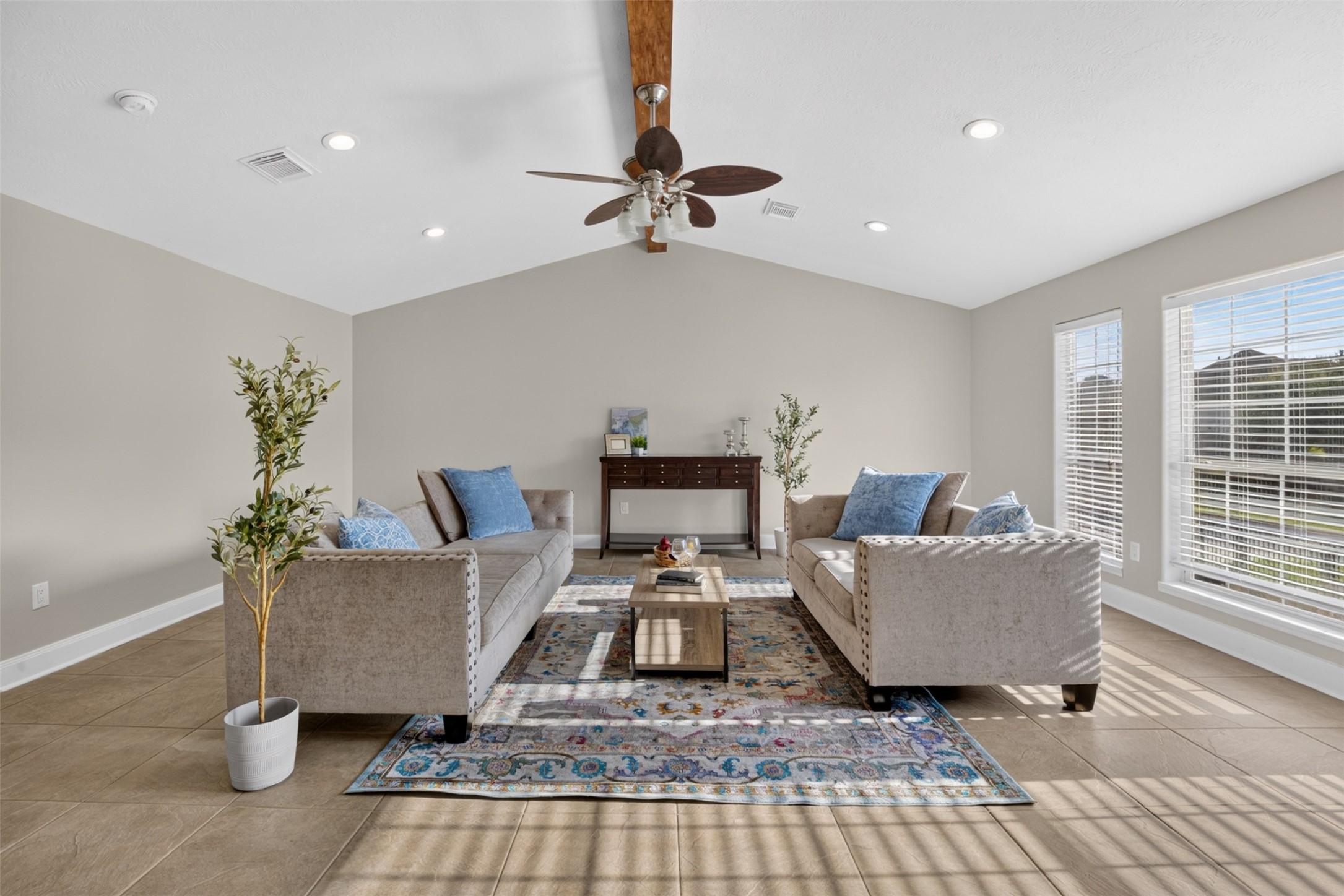 Absolutely flooding with natural light, this living room is paramount for elevated family gatherings, as well as everyday living.