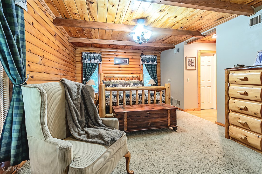 49144 Hickman Road Calcutta, OH 43920 - Photo 11 of 23 Carpeted bedroom with beam ceiling and wooden ceiling