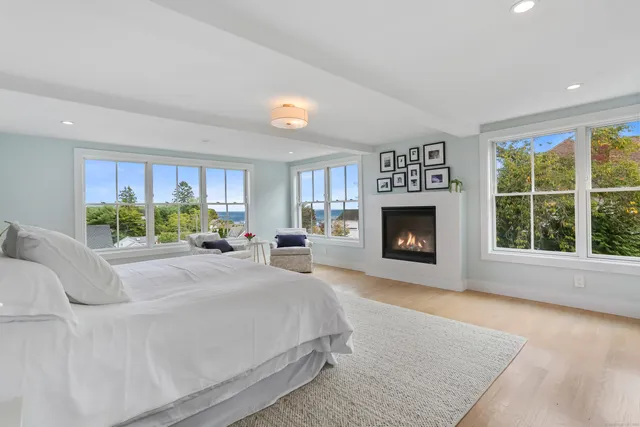 a bed room with a bed and a fireplace