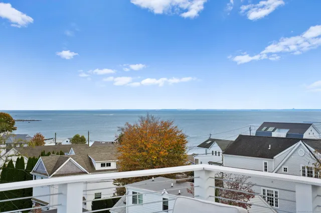 an aerial view of a house with a ocean view