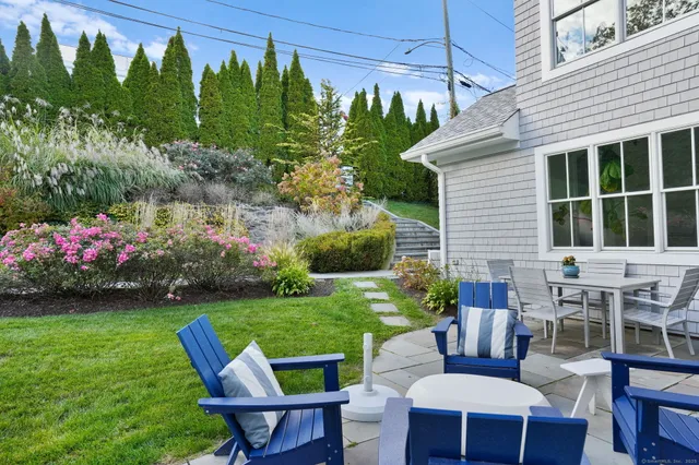a view of yard with outdoor seating and green space
