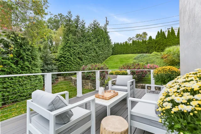 a view of roof deck with furniture