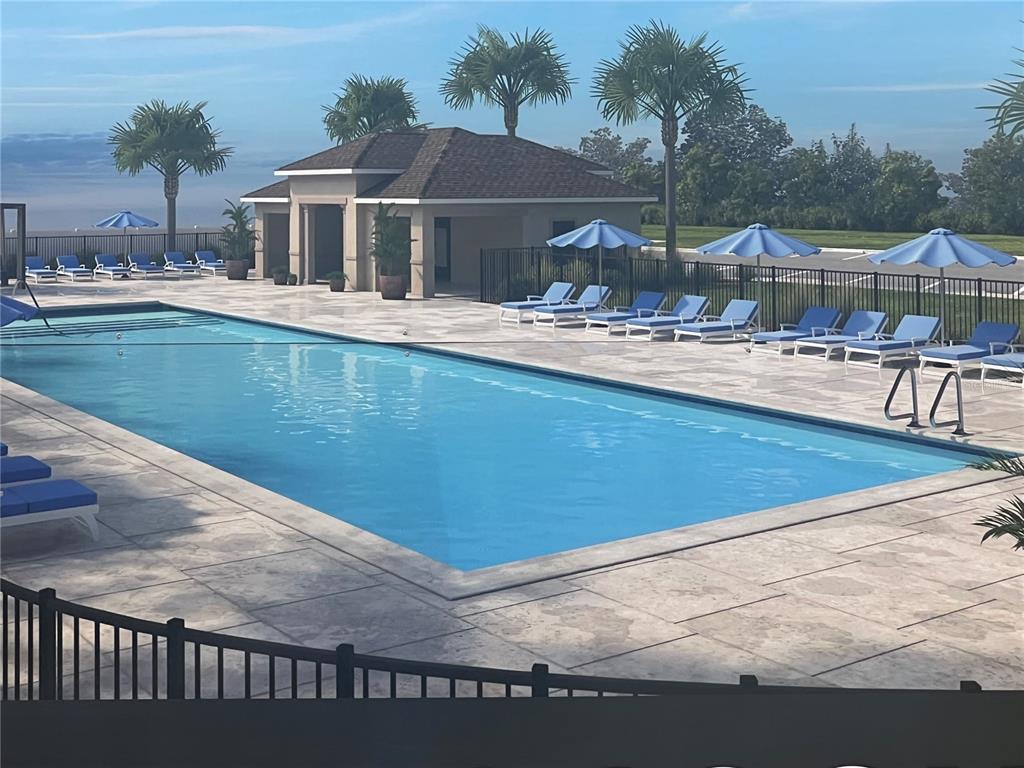 371 Ridgemark Avenue Groveland, FL 34736 - Photo 2 of 2 a view of a house with pool and chairs