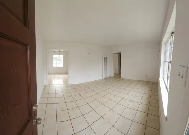 a view of an empty room and window