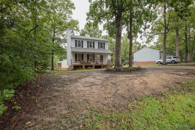 4407 Parrish Branch Road Midlothian, VA 23112 - Photo 3 of 35 a view of a house with a yard and large trees
