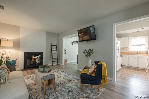 4407 Parrish Branch Road Midlothian, VA 23112 - Photo 8 of 35 a living room with furniture and a fireplace