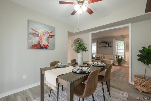 4407 Parrish Branch Road Midlothian, VA 23112 - Photo 10 of 35 a view of a dining room with furniture and wooden floor