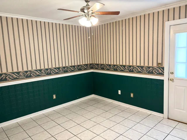 wooden floor in a hall with an empty room