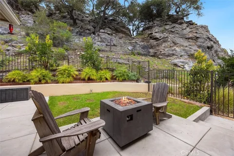 a view of outdoor sitting area with furniture
