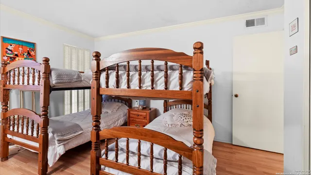 a bedroom with furniture and a window