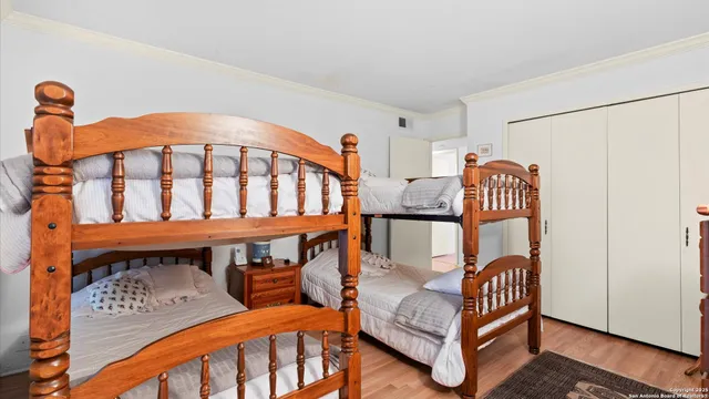 a bedroom with furniture and a baby crib