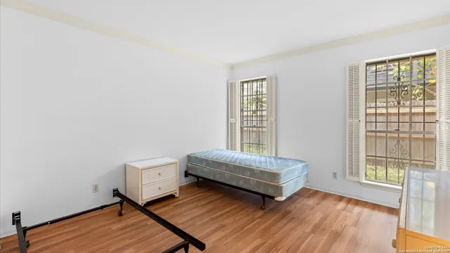 a room with a bed and a window