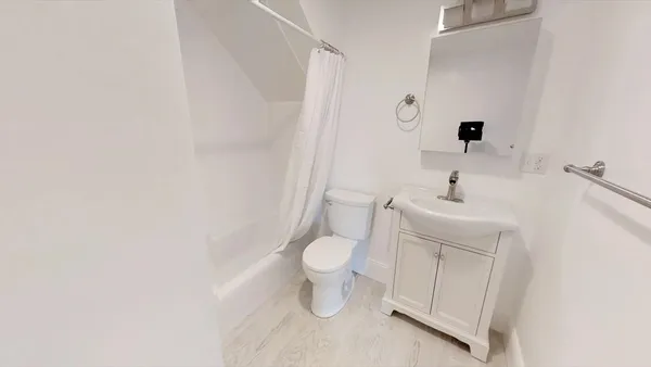 a bathroom with a toilet and a sink