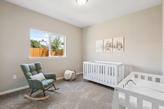a bedroom with furniture and a window