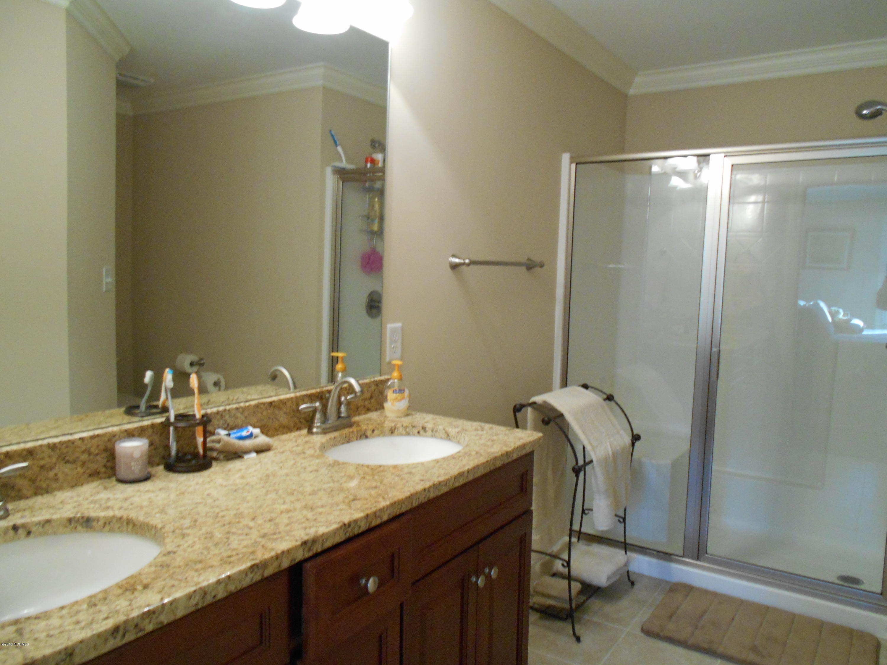 2001 Pinehurst Road Southport, NC 28461 - Photo 11 of 19 main bath 2 sinks, granite counter tops, walk in shower
