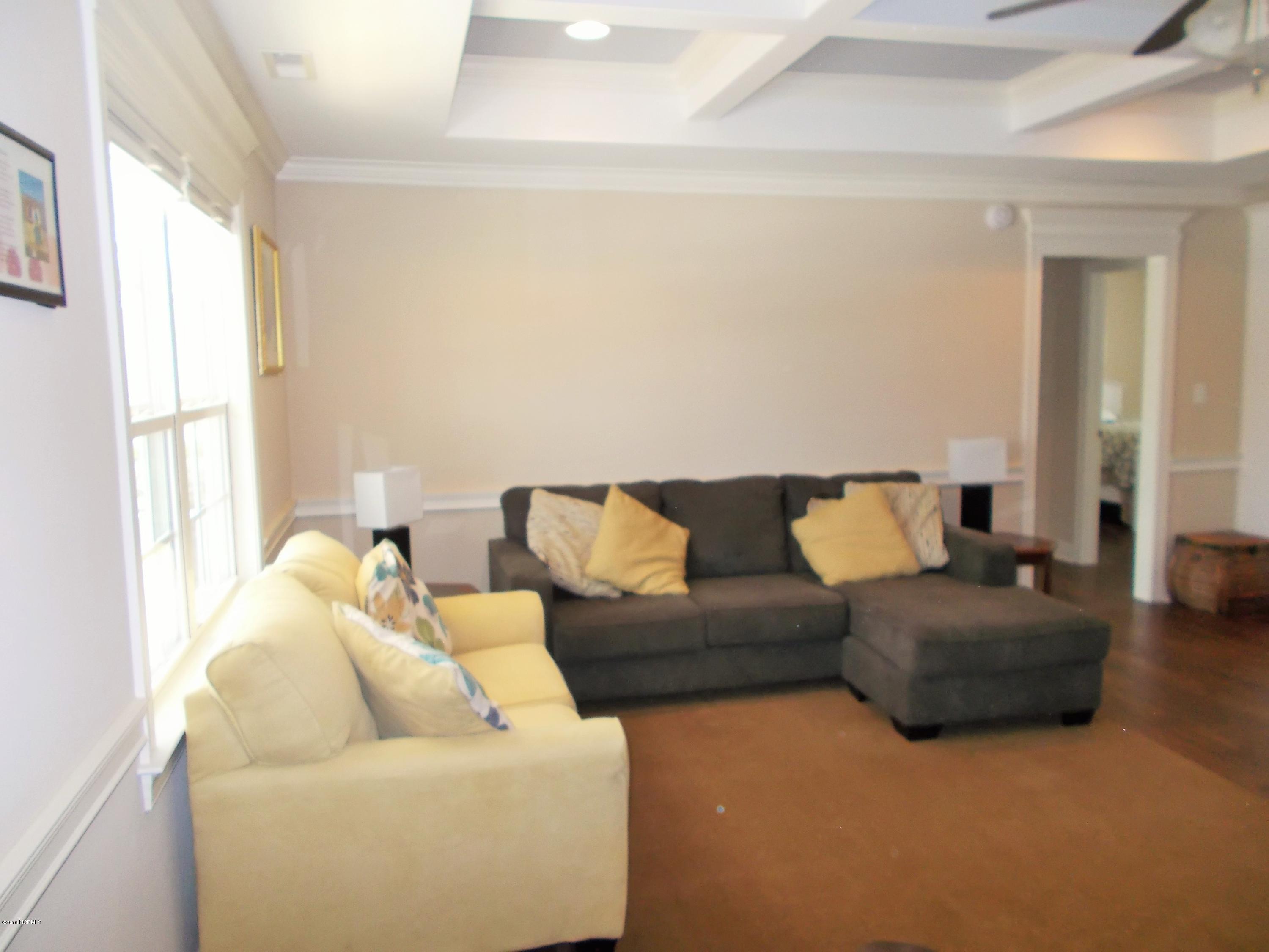 2001 Pinehurst Road Southport, NC 28461 - Photo 17 of 19 living area adjacent to left wing of home
