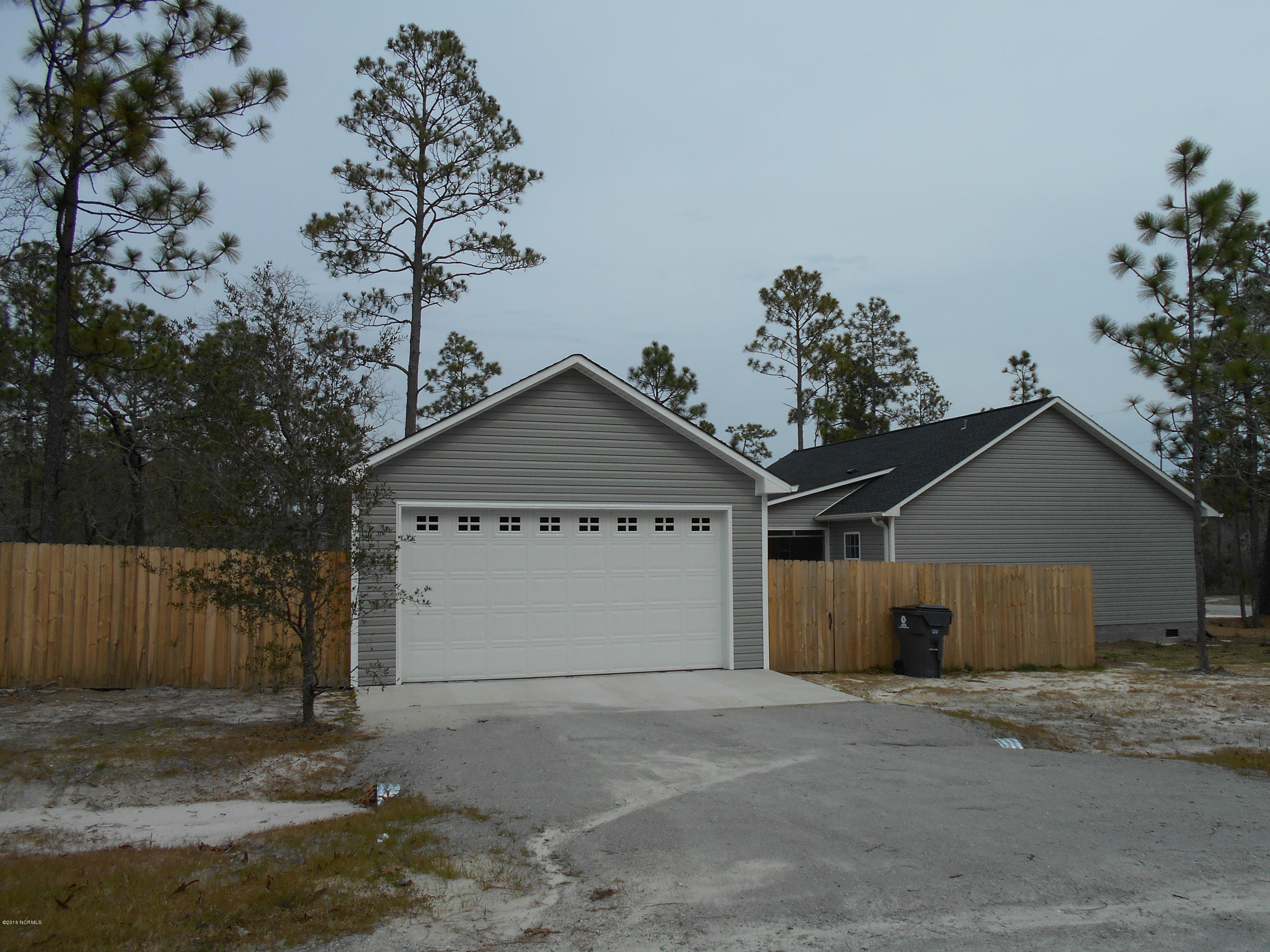 2001 Pinehurst Road Southport, NC 28461 - Photo 3 of 19 side street entry to garage