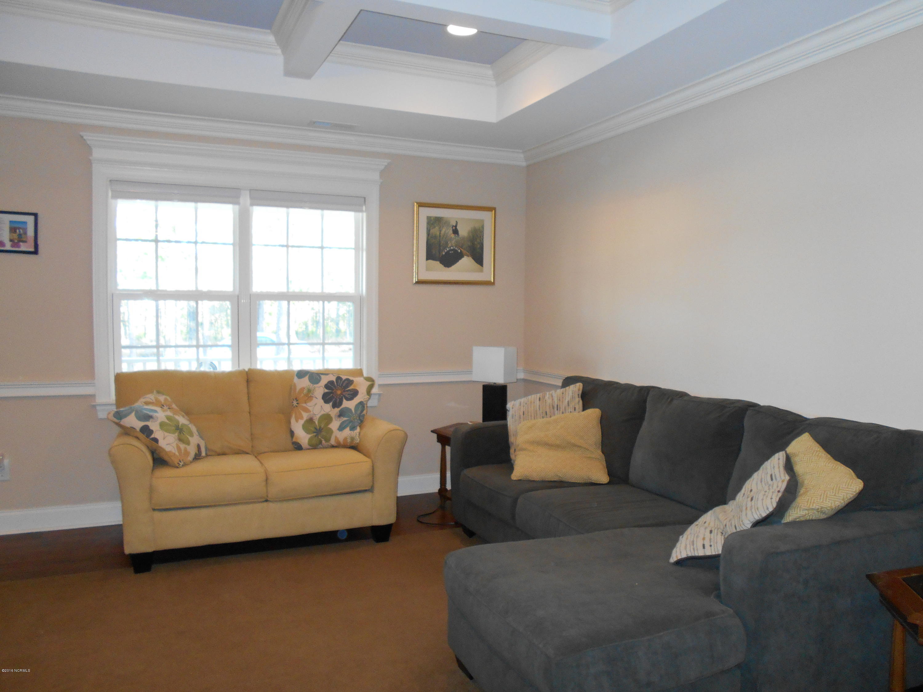 2001 Pinehurst Road Southport, NC 28461 - Photo 4 of 19 living room area with decorative ceiling