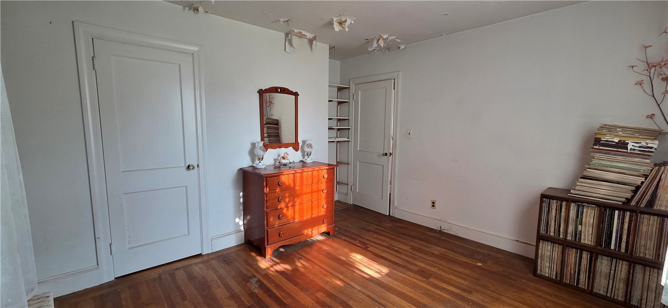 20 Intervale Road Cranston, RI 02910 - Photo 12 of 19 Front bedroom with closet has storage shelves.