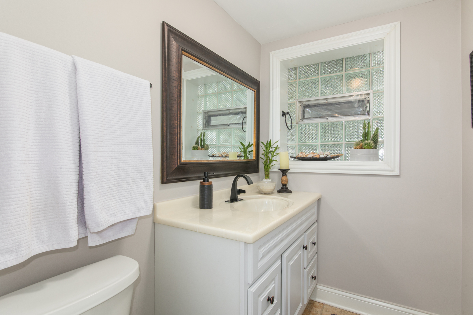 900 Rowe Avenue Park Ridge, IL 60068 - Photo 31 of 32 a bathroom with a sink a toilet and a mirror