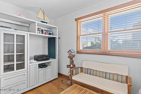 a bedroom with furniture and a window