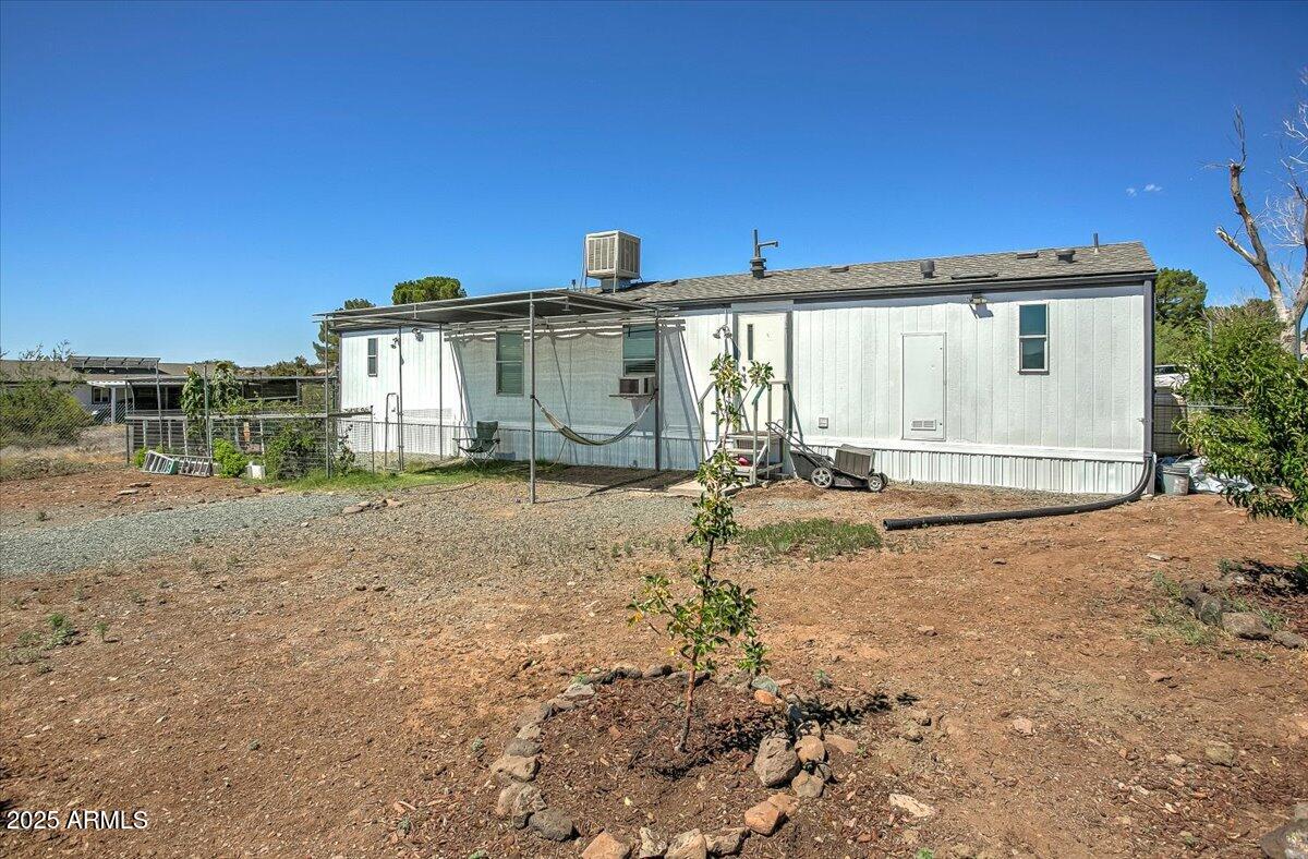 15339 South Rolling Ridge Drive Mayer, AZ 86333 - Photo 18 of 20 a view of a house with a backyard