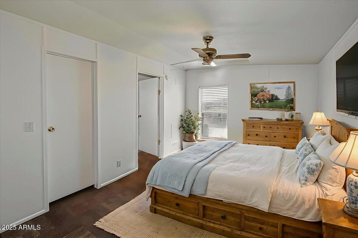 15339 South Rolling Ridge Drive Mayer, AZ 86333 - Photo 2 of 20 a bedroom with a bed and a chandelier