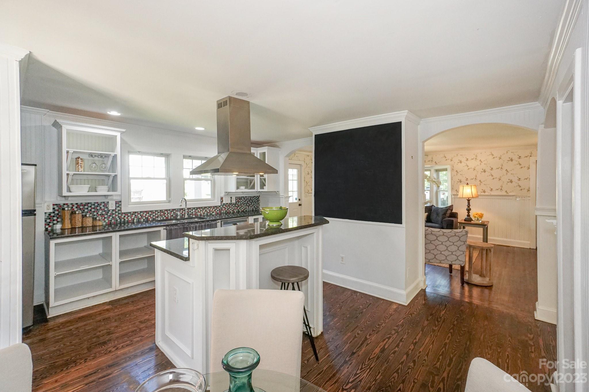 303 Houston Street Davidson, NC 28036 - Photo 13 of 29 a kitchen with a table and chairs