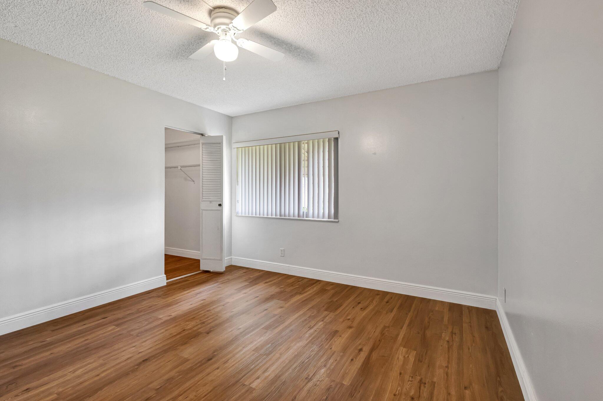 335 Knotty Pine Circle, Unit A1 Greenacres, FL 33463 - Photo 13 of 31 Primary Bedroom