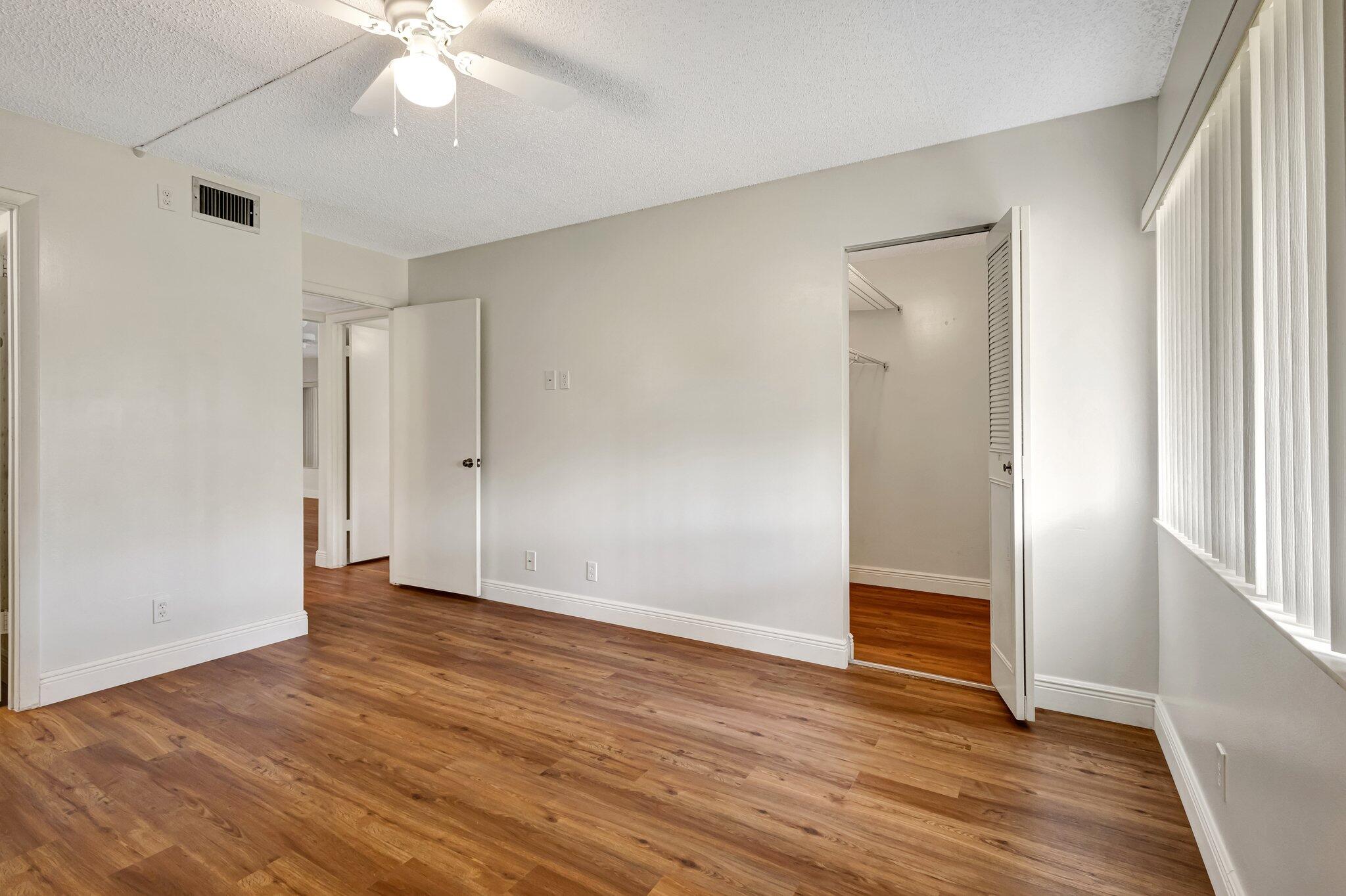 335 Knotty Pine Circle, Unit A1 Greenacres, FL 33463 - Photo 14 of 31 Primary Bedroom