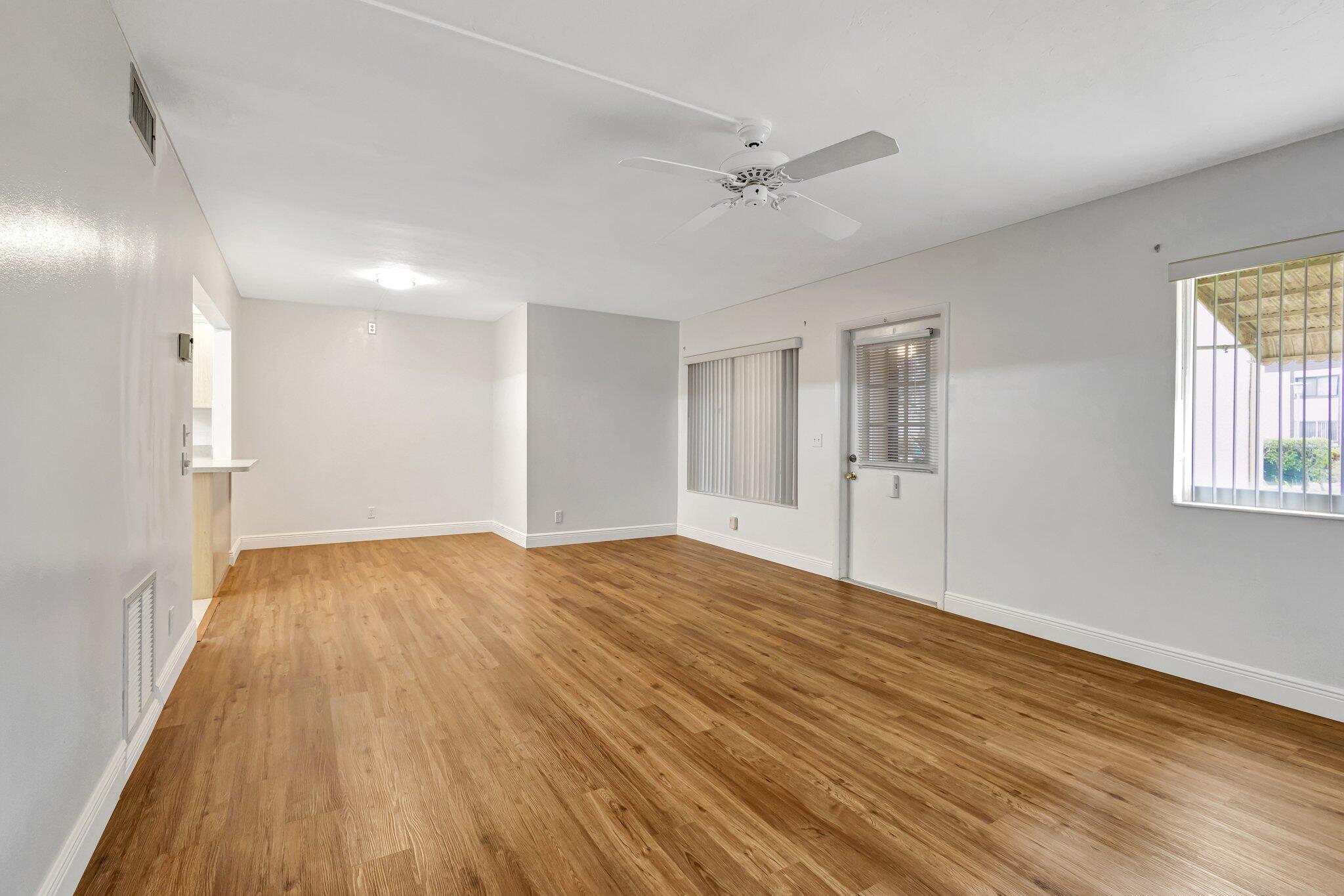 335 Knotty Pine Circle, Unit A1 Greenacres, FL 33463 - Photo 2 of 31 Living/Dining Area