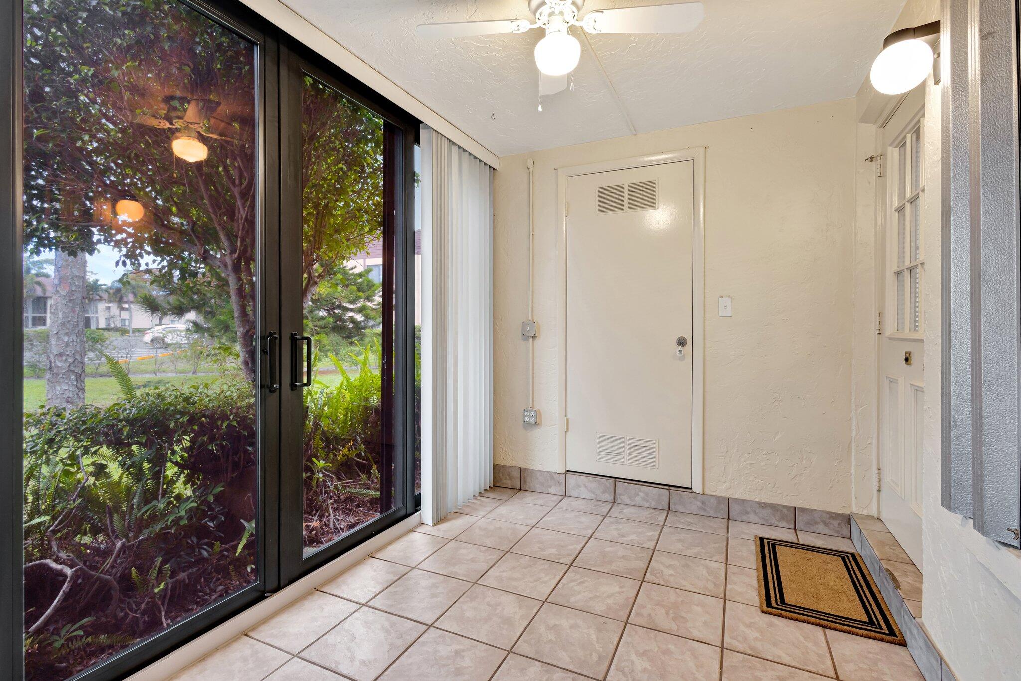 335 Knotty Pine Circle, Unit A1 Greenacres, FL 33463 - Photo 21 of 31 Enclosed Front Porch