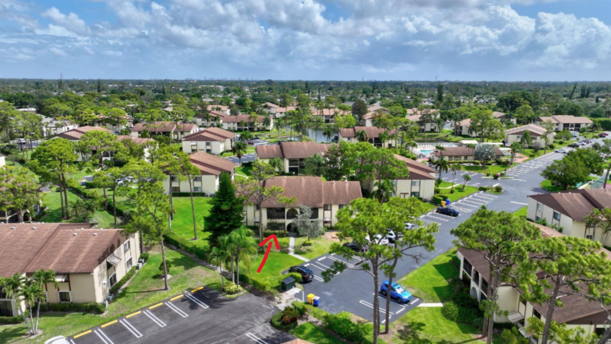 335 Knotty Pine Circle, Unit A1 Greenacres, FL 33463 - Photo 23 of 31 Aerial Front View of the Building