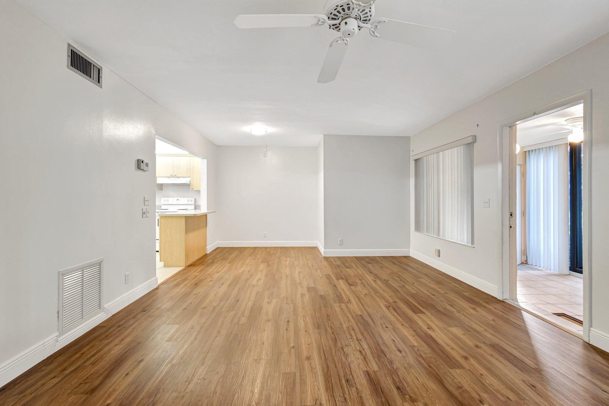 335 Knotty Pine Circle, Unit A1 Greenacres, FL 33463 - Photo 3 of 31 Living/Dining Area