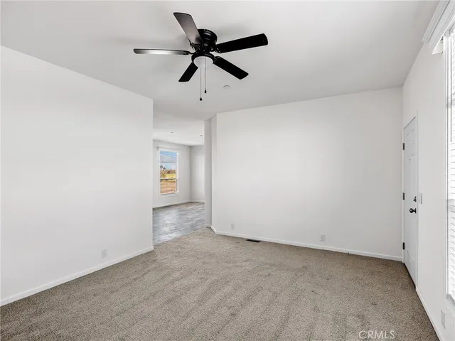 a view of a big room with carpet