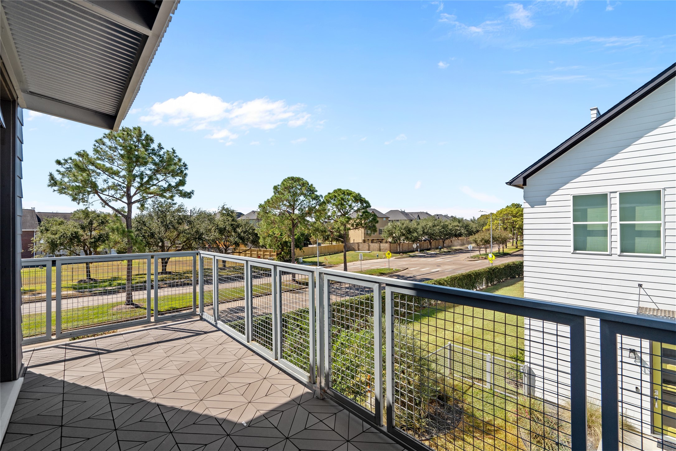 9855 Mocking Bird Hill Lane Houston, TX 77080 - Photo 11 of 15 a view of a balcony with floor to ceiling windows with wooden fence